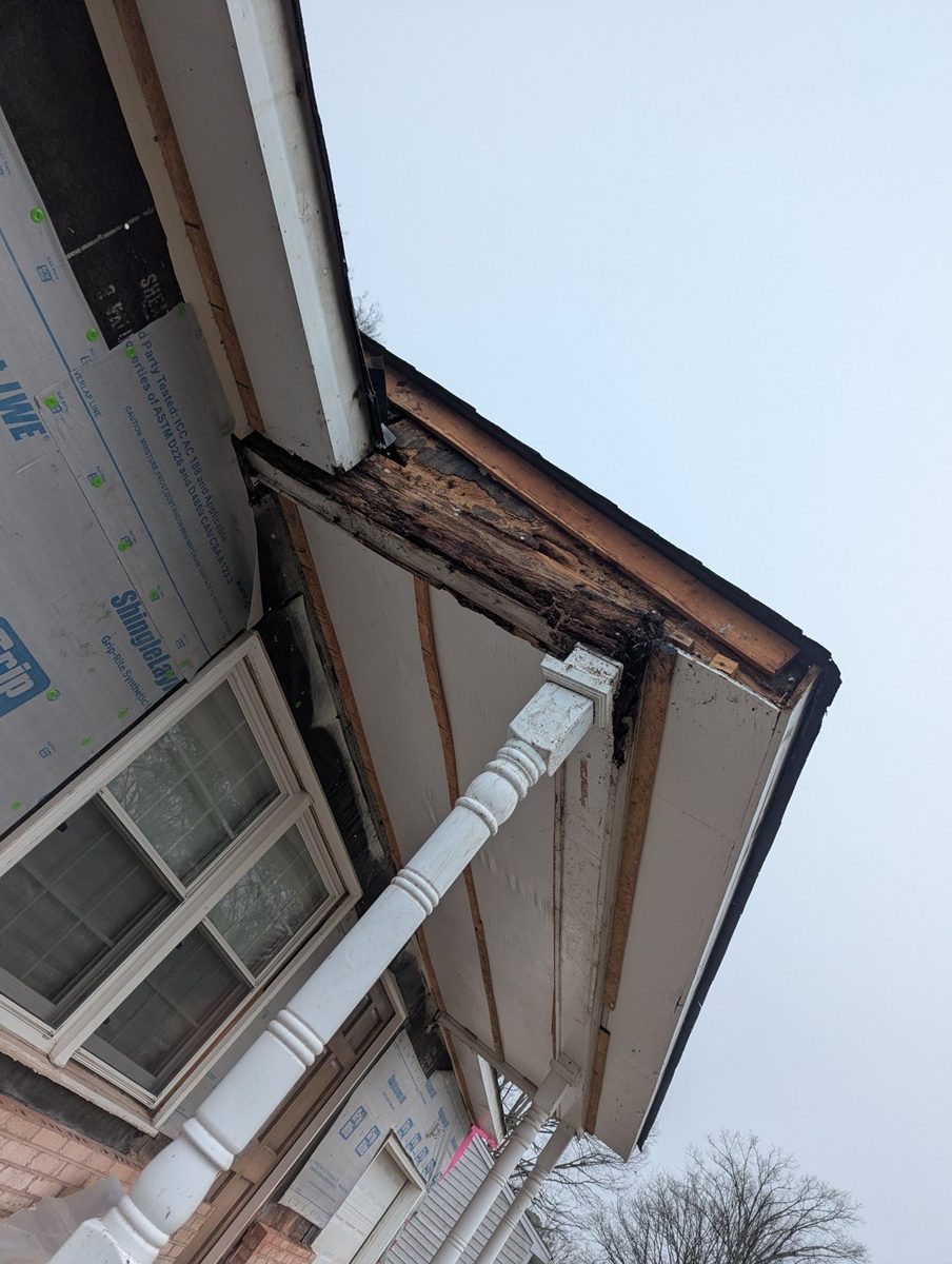 Rotted fascia and soffit framing at a porch roof